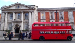 Guests enjoy mild Spring air beside bus - Chelsea Old Town Hall, King's Road