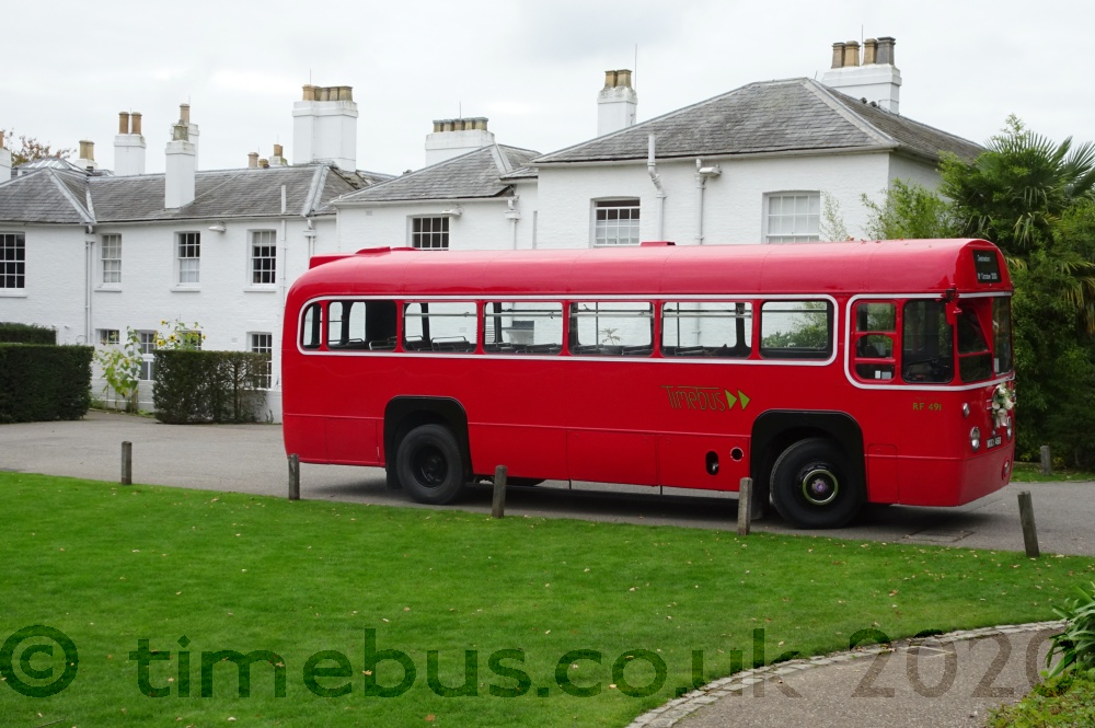 Vintage single decker bus is well proportioned by lawn - Pembroke Lodge, Richmond Park