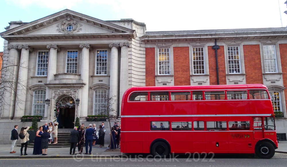 Guests enjoy mild Spring air beside bus - Chelsea Old Town Hall, King's Road