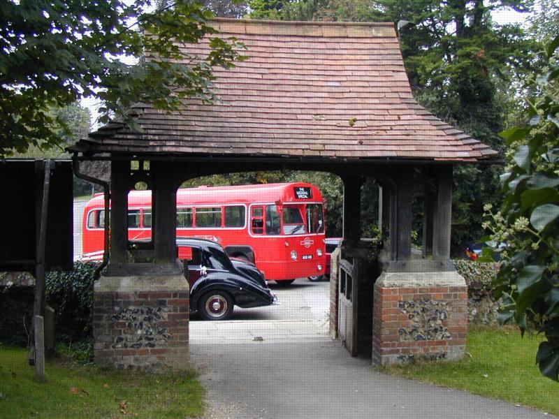 Lych gate frames single decker bus - St Nicholas Church, Rectory Lane, Stevenage