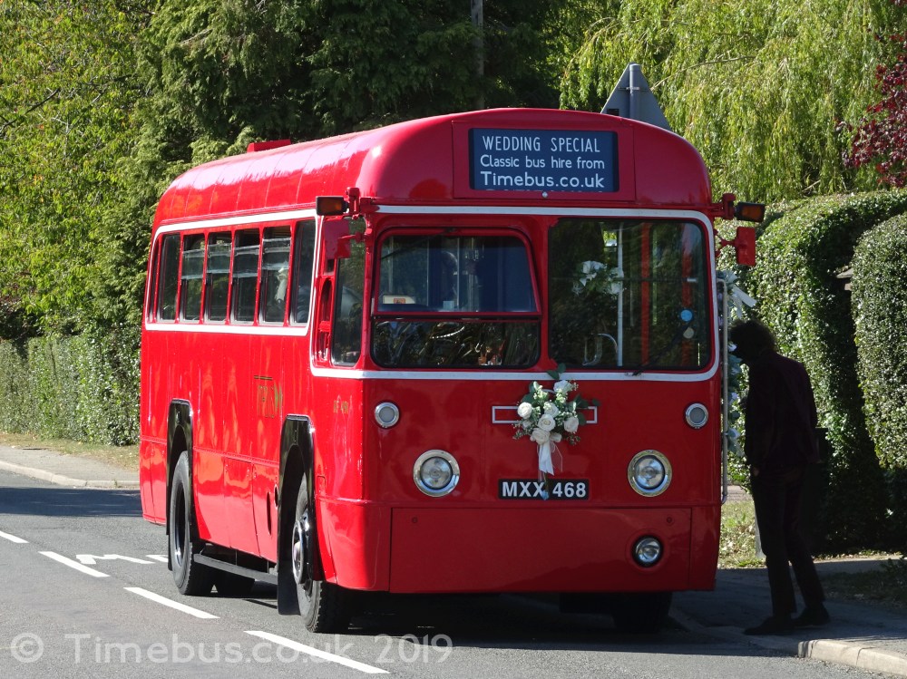 Single storey vintage bus at the roadside - Potten End