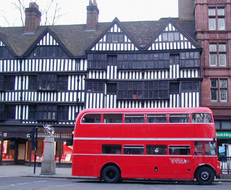 Tudor frontage contrasts with curved Routemaster - Staple Inn, High Holborn
