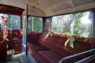 Garlands surround entrance and bench seats